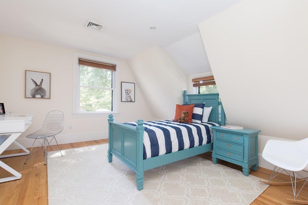 11 Channing Street Cambridge, MA 02138 - Photo 11 of 14 a bed room with a bed and chair