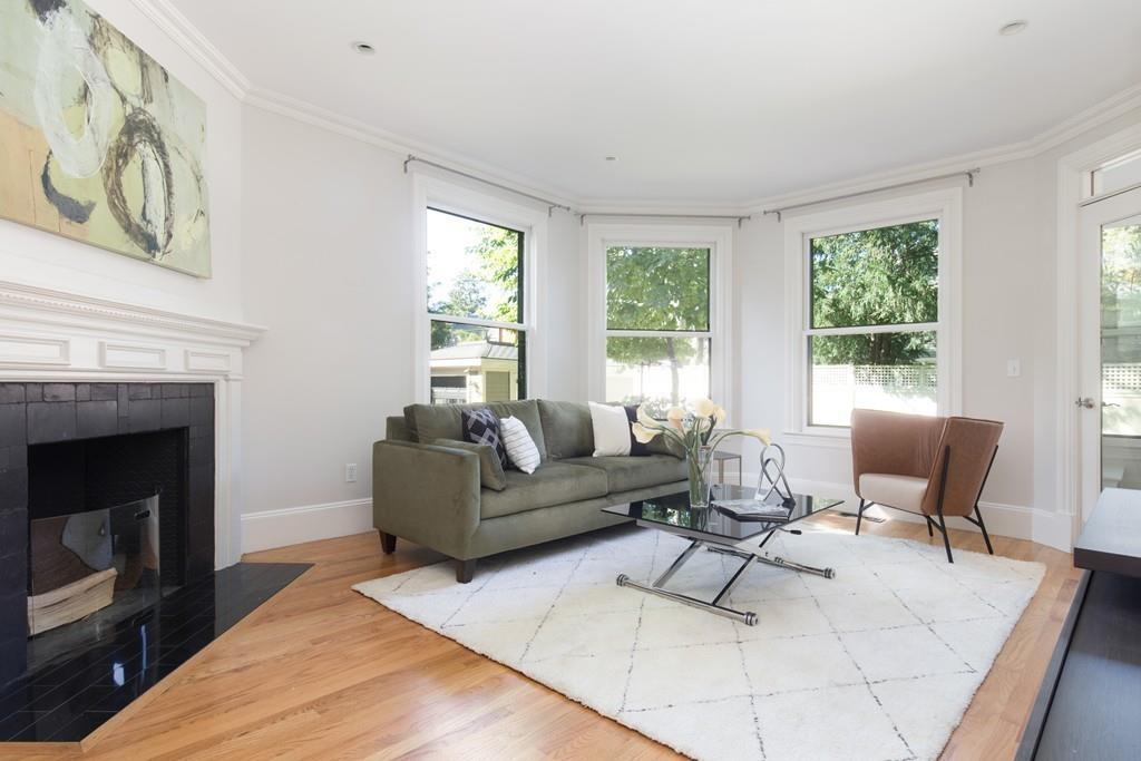 11 Channing Street Cambridge, MA 02138 - Photo 5 of 14 a living room with furniture and a fireplace