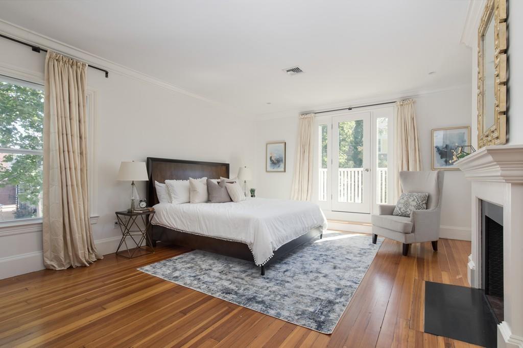11 Channing Street Cambridge, MA 02138 - Photo 6 of 14 a bed sitting in a spacious bedroom next to a window