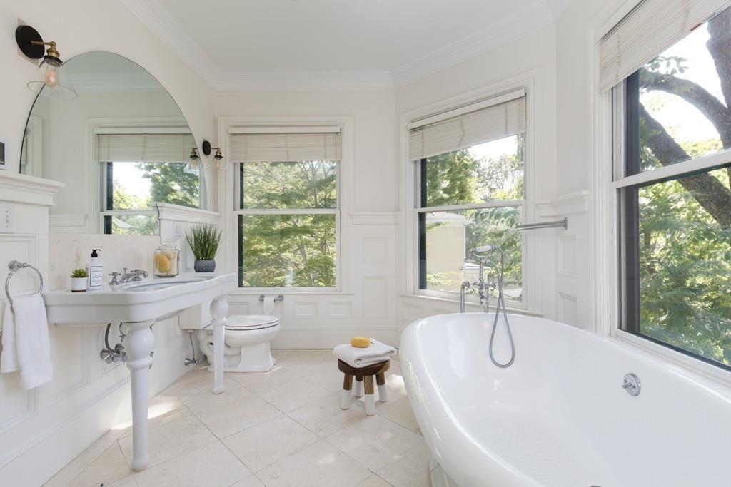 11 Channing Street Cambridge, MA 02138 - Photo 7 of 14 a bathroom with a tub sink and mirror