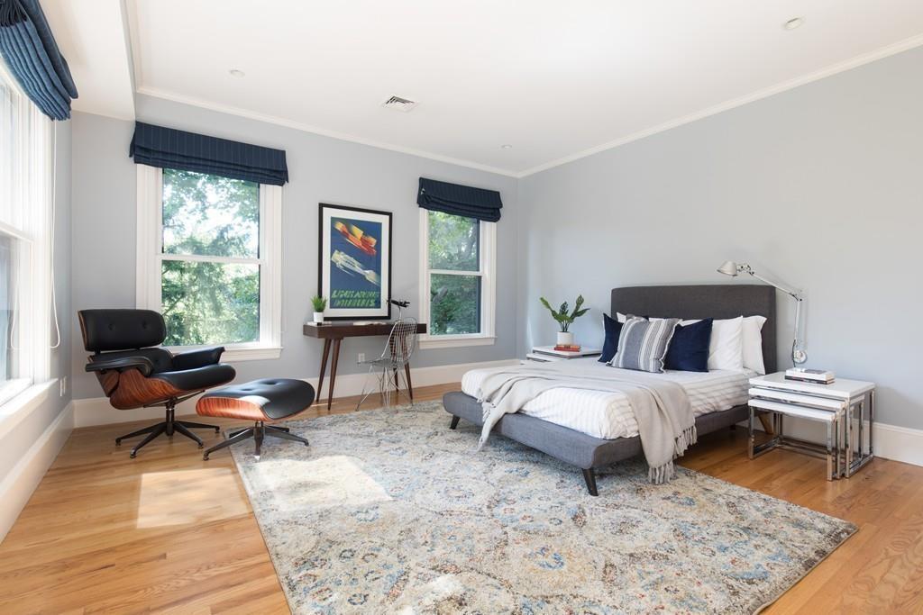 11 Channing Street Cambridge, MA 02138 - Photo 9 of 14 a bedroom with a bed and wooden floor