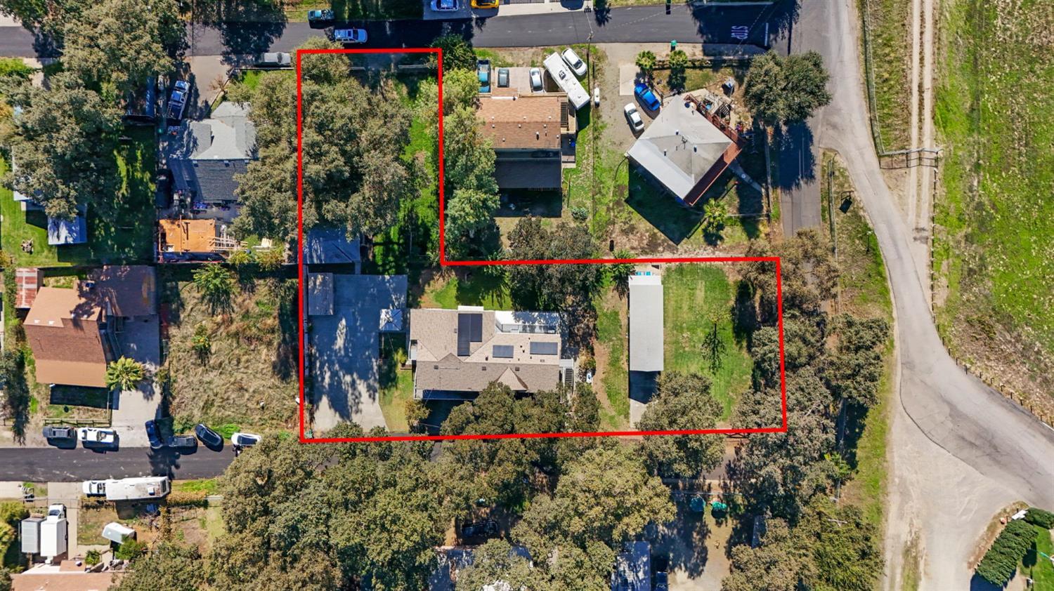 825 Wetherbee Avenue Manteca, CA 95337 - Photo 14 of 22 an aerial view of multi story residential apartment building with yard and parking