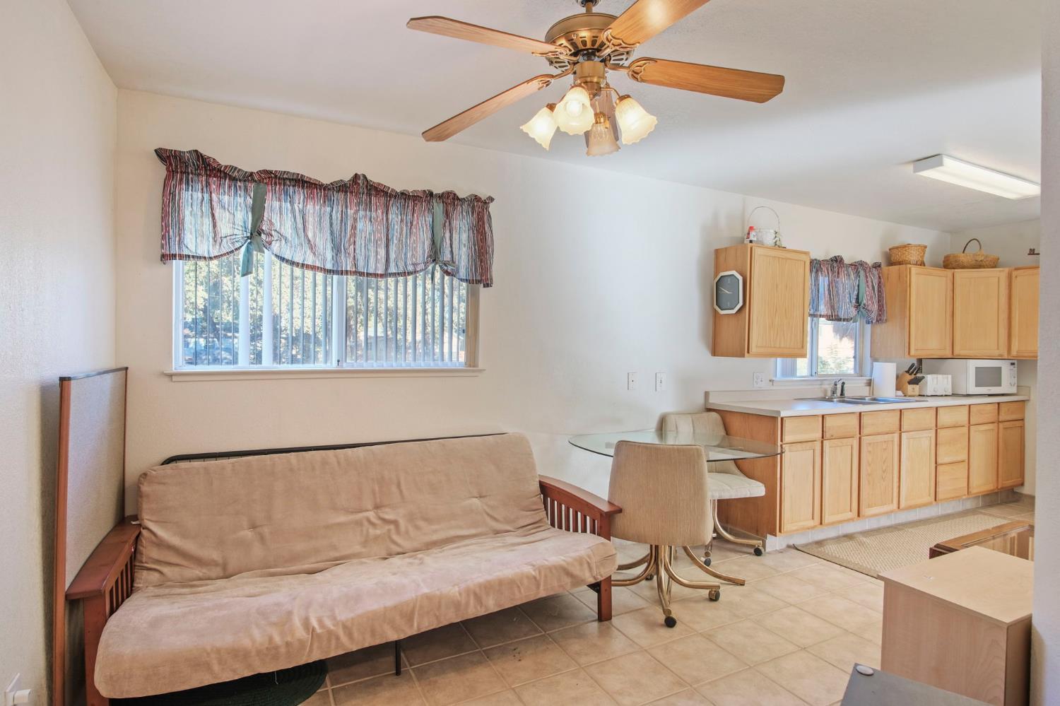 825 Wetherbee Avenue Manteca, CA 95337 - Photo 2 of 22 a living room with furniture and a window