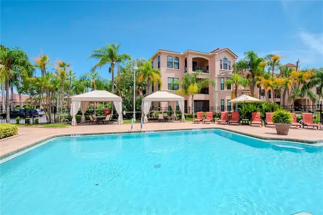 a outdoor space with lots of trees and umbrellas