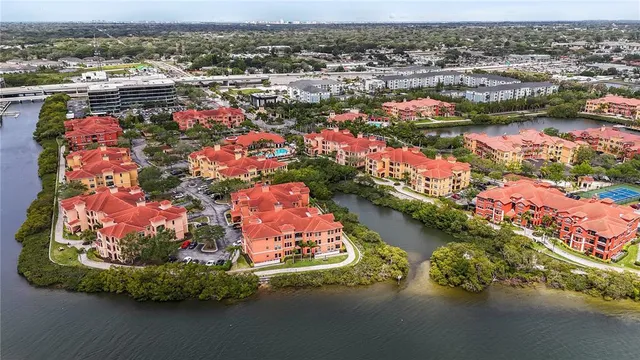 an aerial view of residential houses and outdoor space