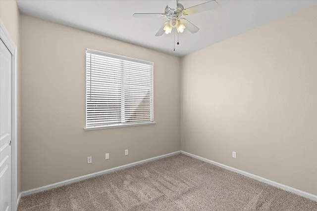 an entryway with wooden floor and a cabinet