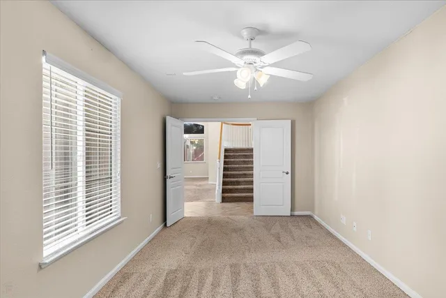 a bathroom with a double vanity sink toilet mirror and shower