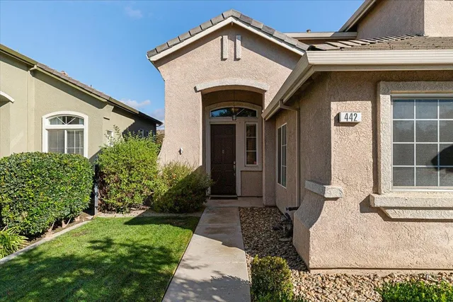 a view of hallway with stairs and wooden floor