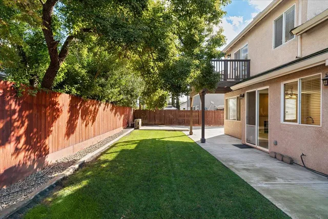 a view of water pond with yard and outdoor seating