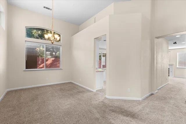 a large kitchen with kitchen island granite countertop a sink and cabinets