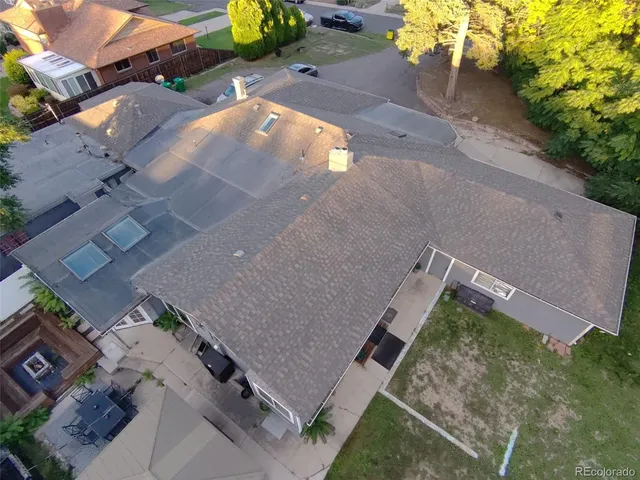 an aerial view of a house with a yard and a garden