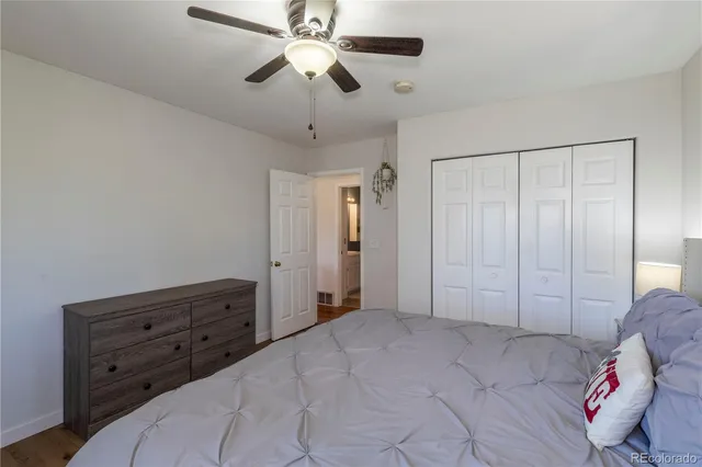 a view of room with cabinet and ceiling fan
