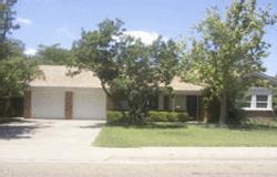 6210 Calumet Road Amarillo, TX 79106 - Photo 1 of 1 a front view of a house with a yard and garage