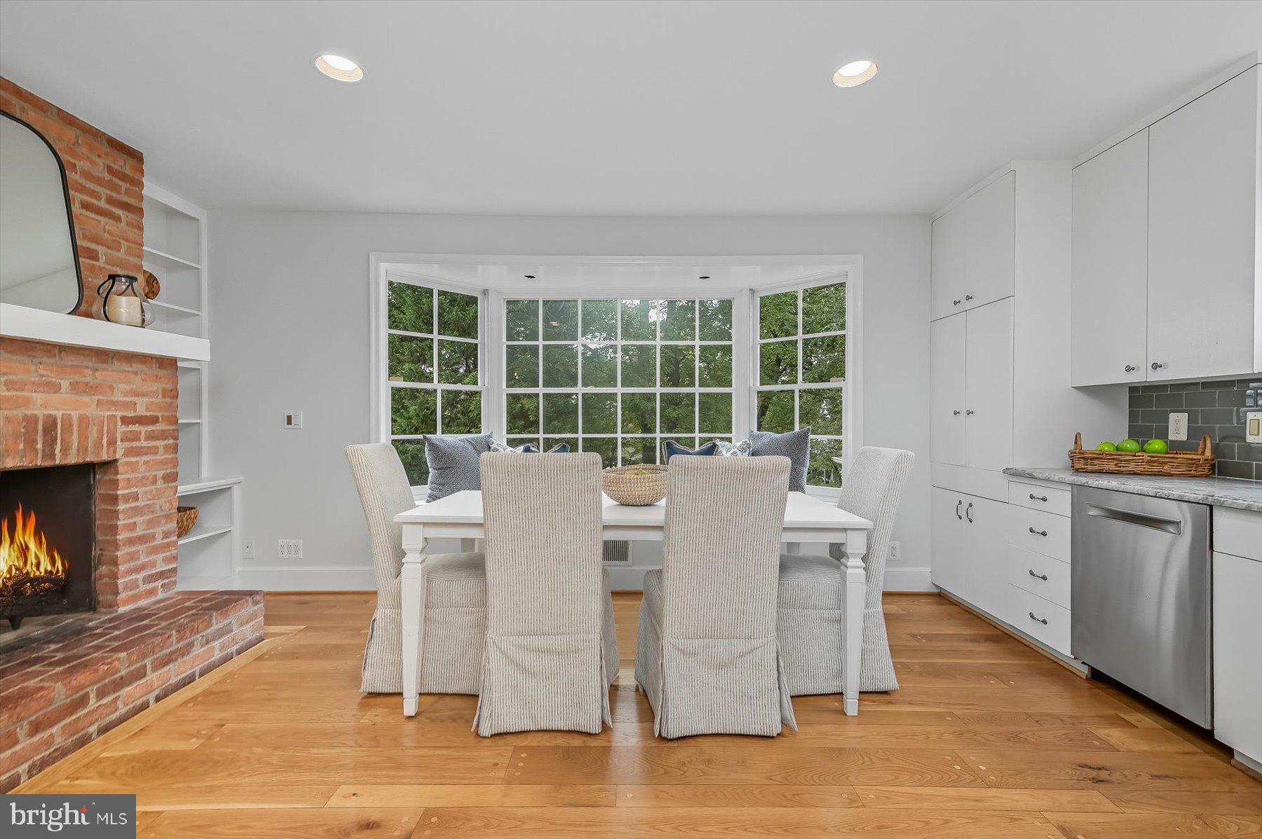 6302 Broad Branch Road Chevy Chase, MD 20815 - Photo 13 of 55 a view of a dining room with furniture window and wooden floor