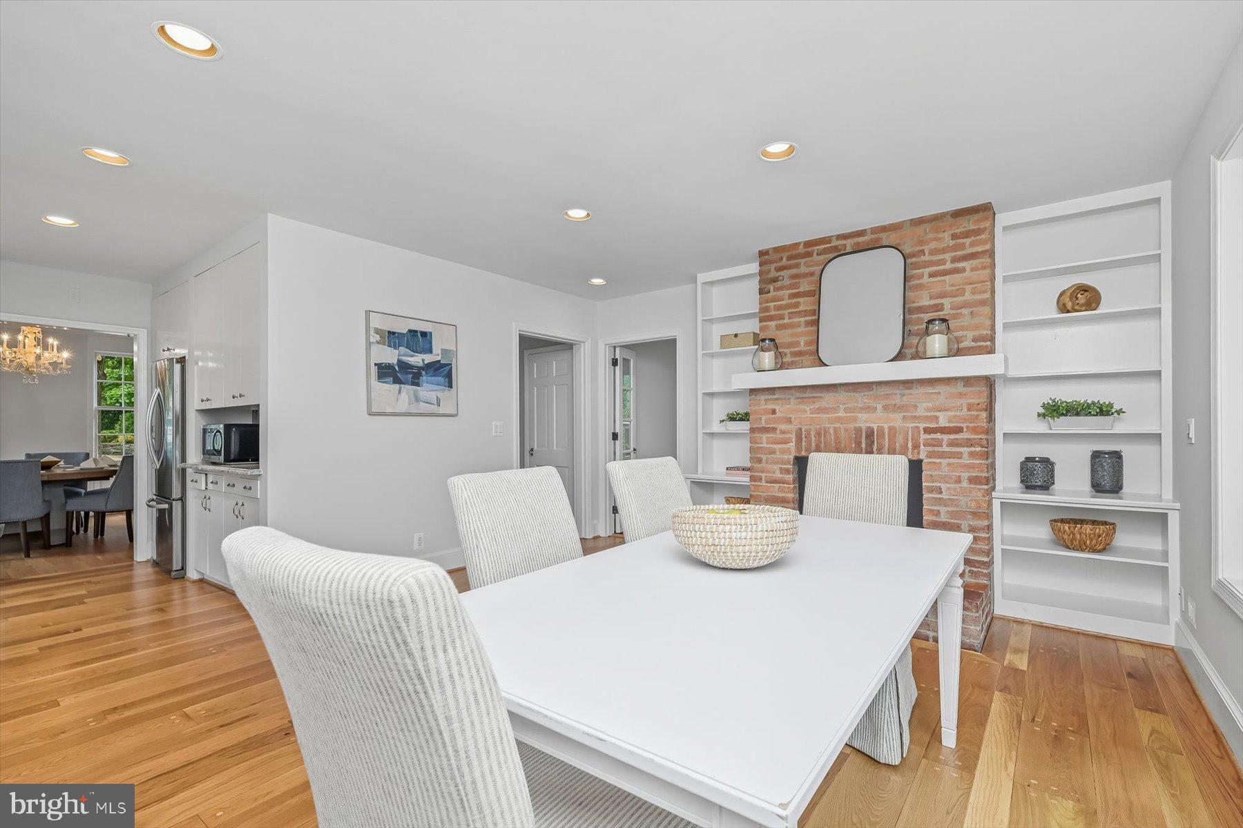 6302 Broad Branch Road Chevy Chase, MD 20815 - Photo 14 of 55 a bedroom with furniture and a fireplace