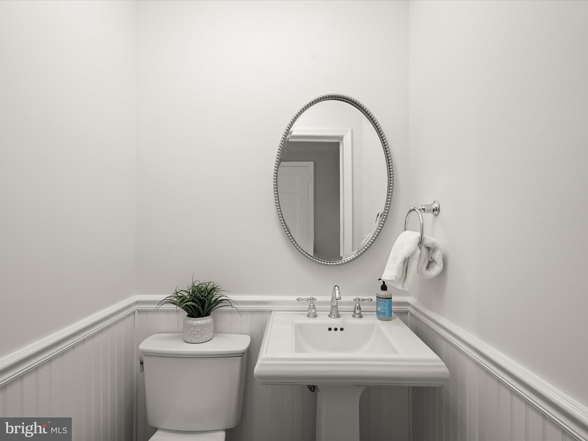 6302 Broad Branch Road Chevy Chase, MD 20815 - Photo 21 of 55 a bathroom with a sink and a mirror