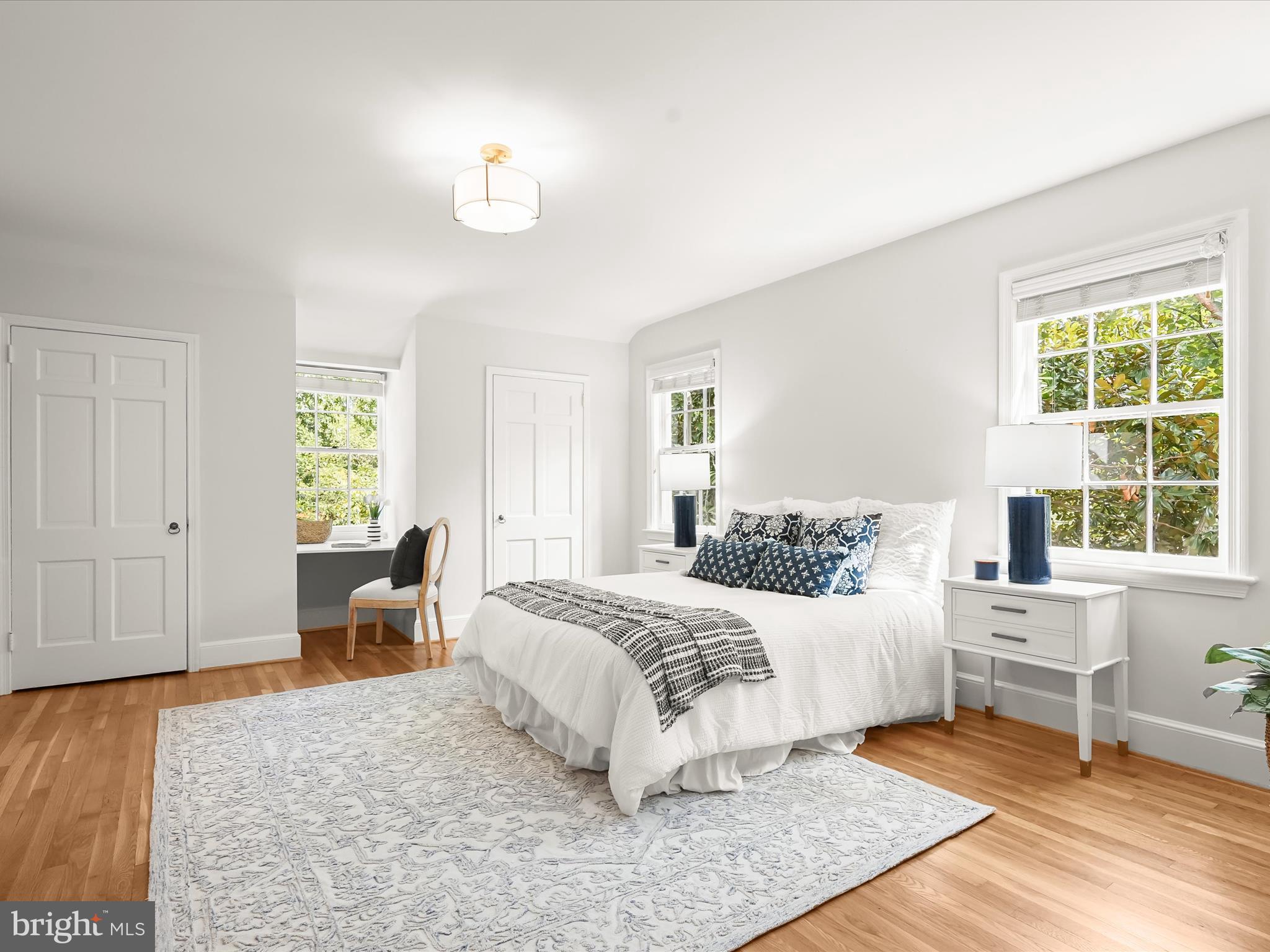 6302 Broad Branch Road Chevy Chase, MD 20815 - Photo 27 of 55 a bedroom with a large bed and a window