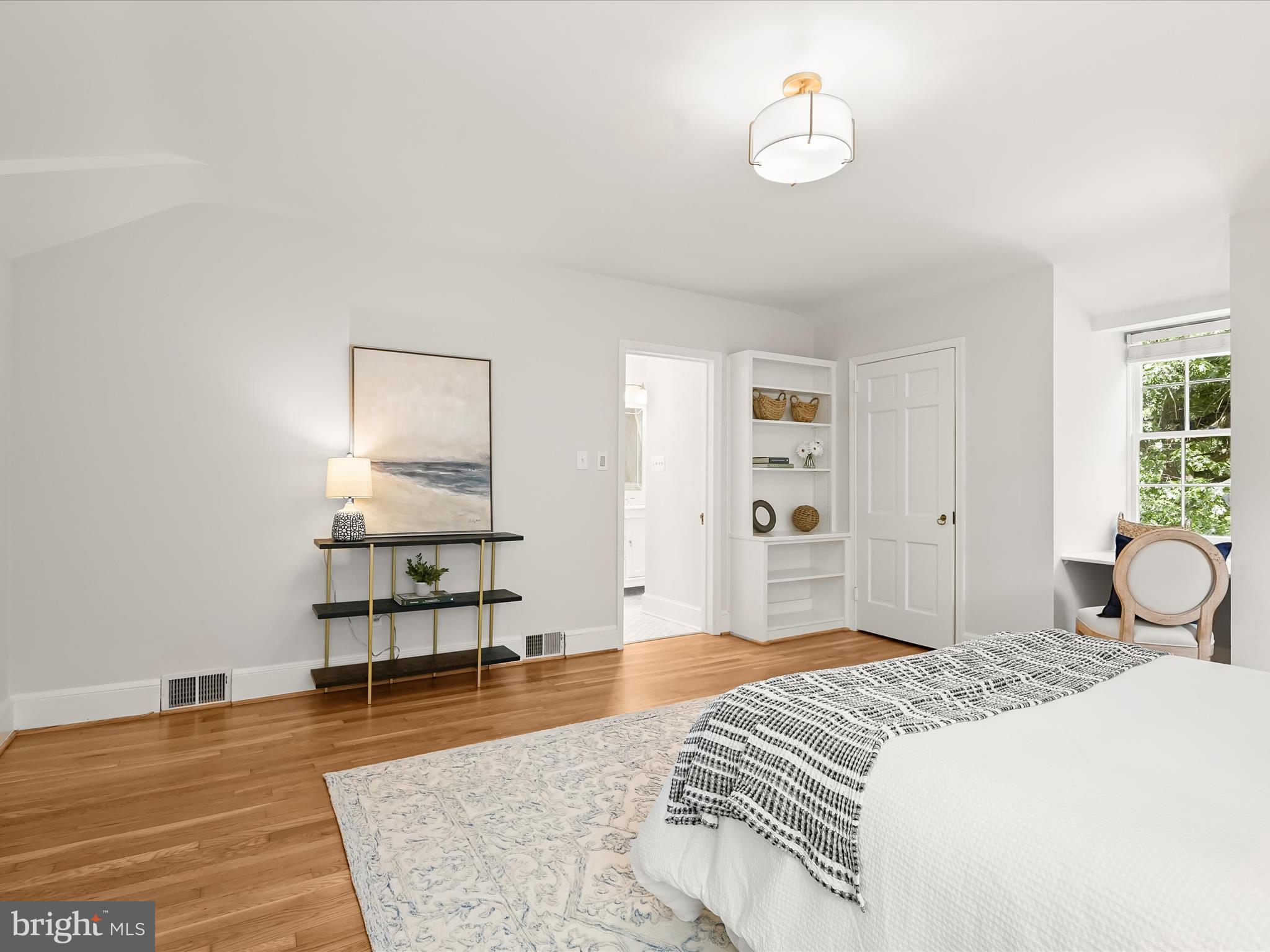 6302 Broad Branch Road Chevy Chase, MD 20815 - Photo 28 of 55 a bedroom with a bed and wooden floor