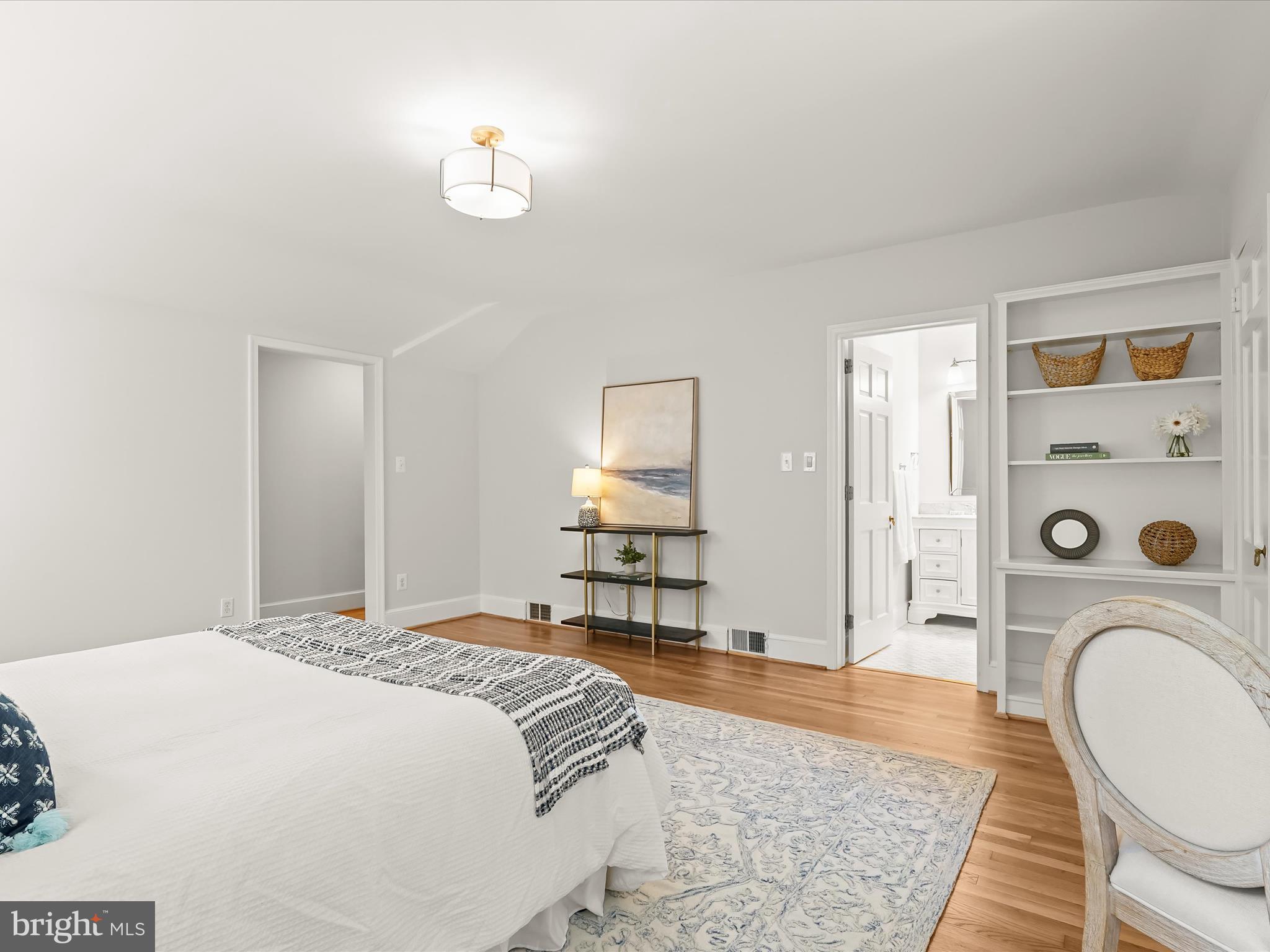 6302 Broad Branch Road Chevy Chase, MD 20815 - Photo 30 of 55 a bedroom with a bed and a dresser with rug