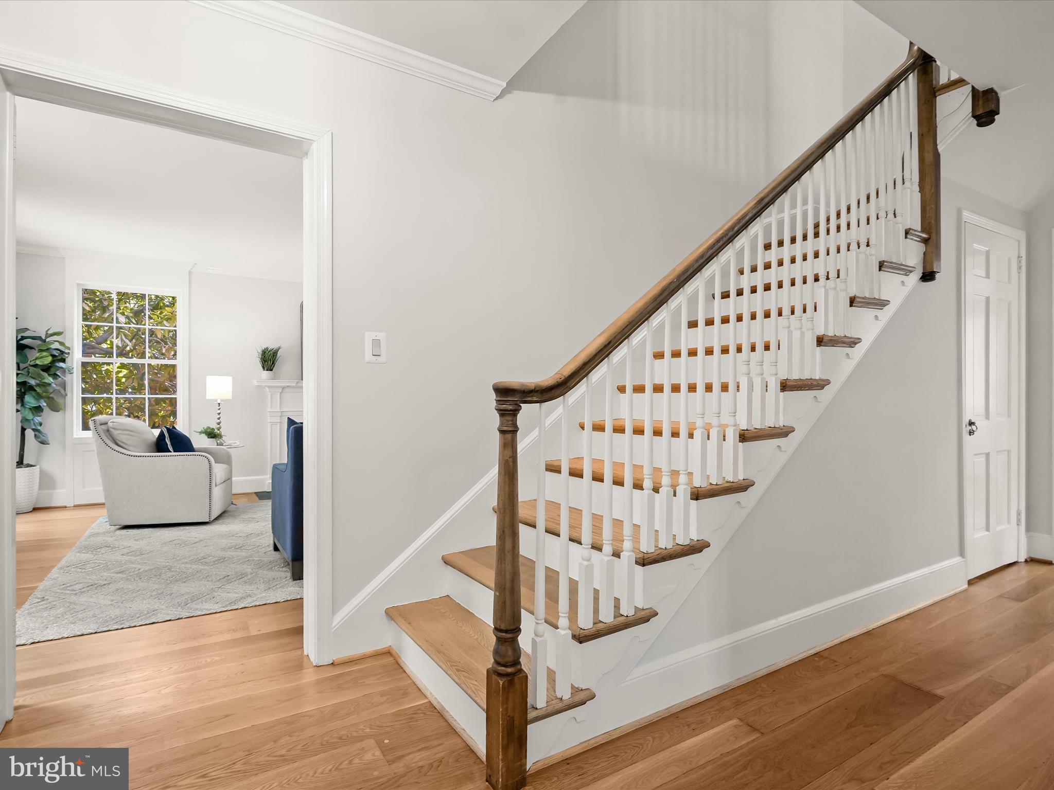 6302 Broad Branch Road Chevy Chase, MD 20815 - Photo 3 of 55 a view of staircase with wooden floor and fan