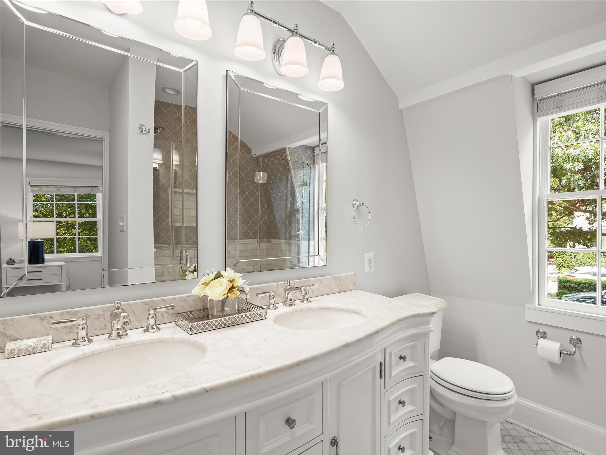 6302 Broad Branch Road Chevy Chase, MD 20815 - Photo 33 of 55 a bathroom with a granite countertop sink mirror and a toilet