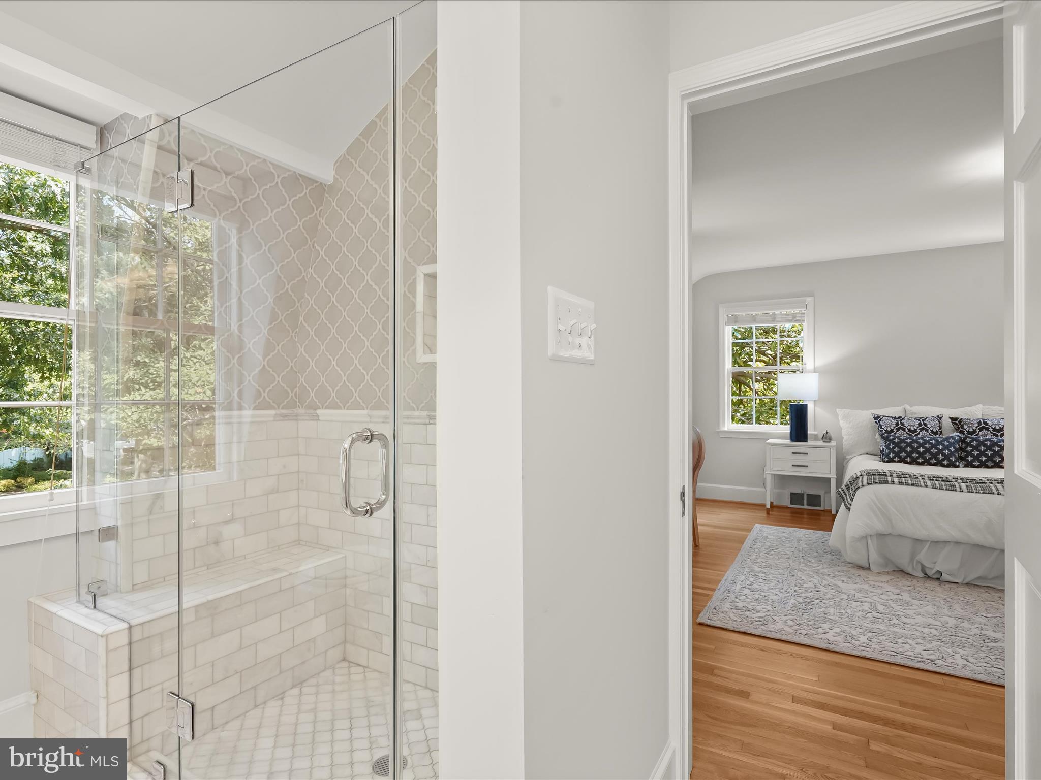 6302 Broad Branch Road Chevy Chase, MD 20815 - Photo 35 of 55 a bedroom with a bed and wooden floor