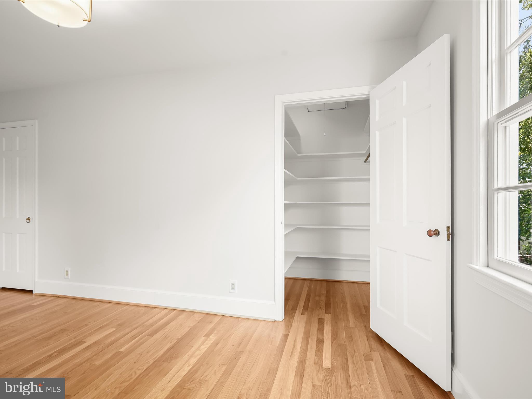 6302 Broad Branch Road Chevy Chase, MD 20815 - Photo 39 of 55 a view of empty room with wooden floor and fan