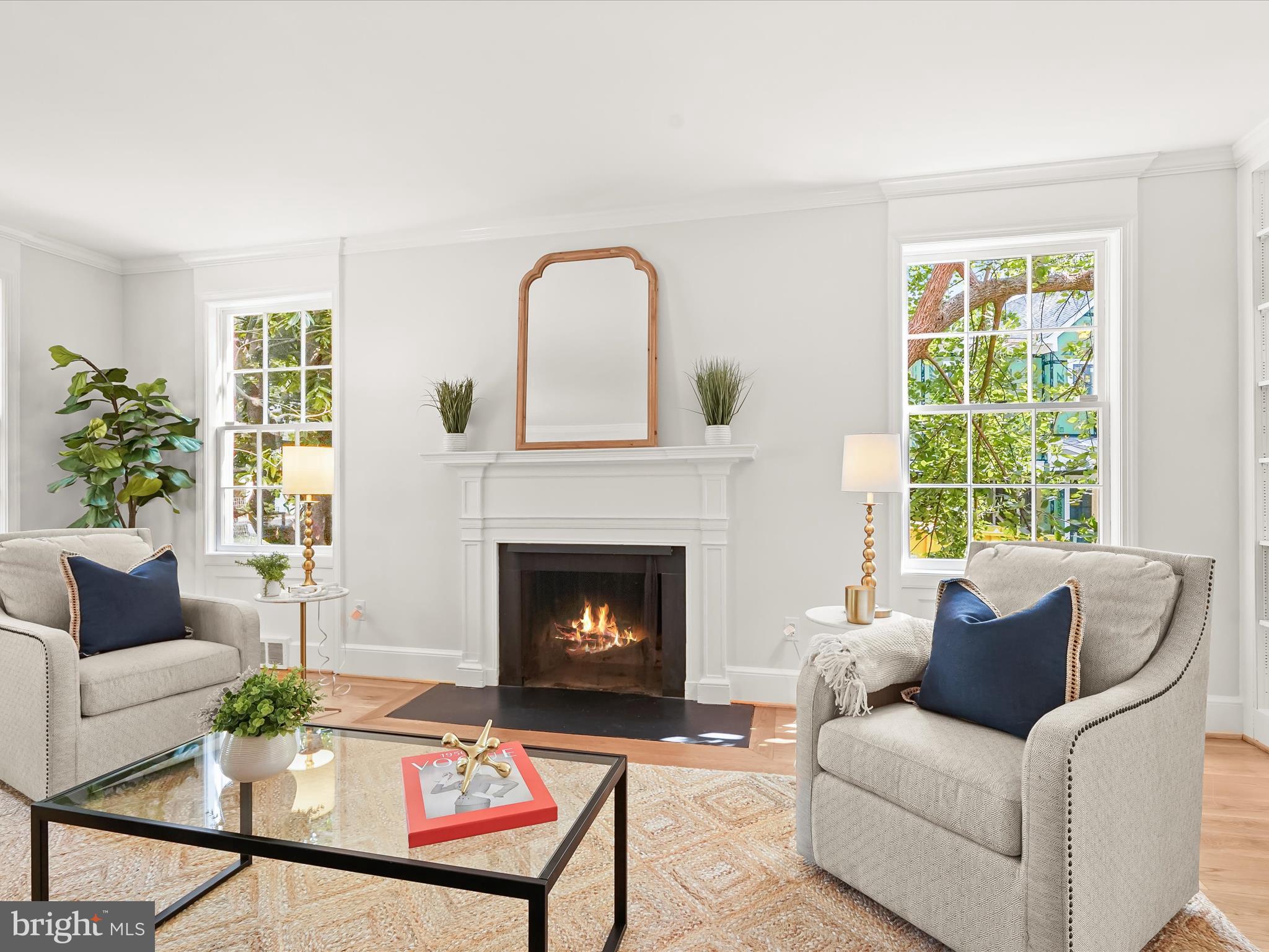 6302 Broad Branch Road Chevy Chase, MD 20815 - Photo 6 of 55 a living room with furniture and a fireplace