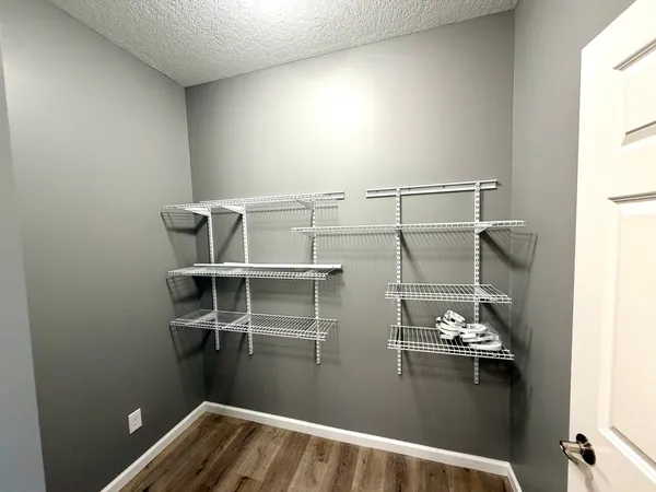 a view of a room with racks on the wall