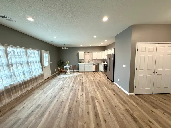 a view of livingroom with furniture wooden floor and window
