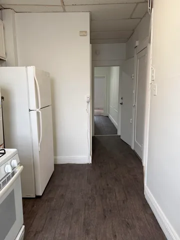 a view of a small space with wooden floor