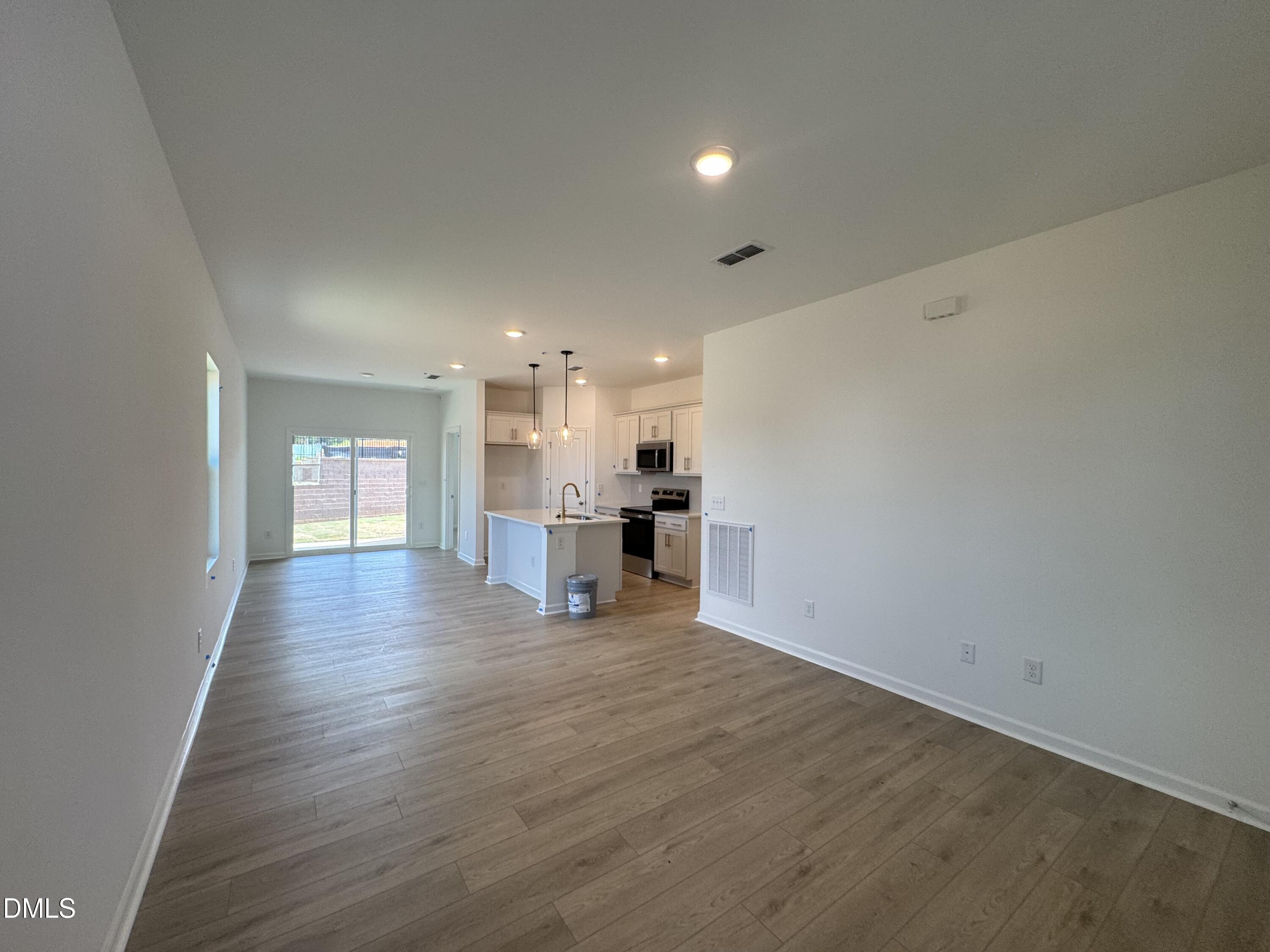 11754 Salers Loop Middlesex, NC 27557 - Photo 4 of 21 a view of a kitchen with a sink and a refrigerator