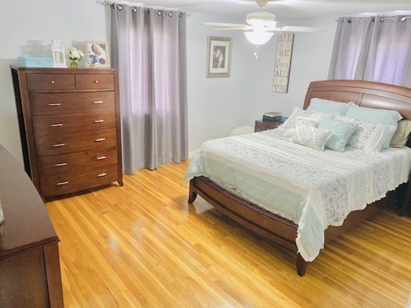 6 Saugus Avenue, Unit A Saugus, MA 01906 - Photo 15 of 26 a bedroom with a bed and cabinets