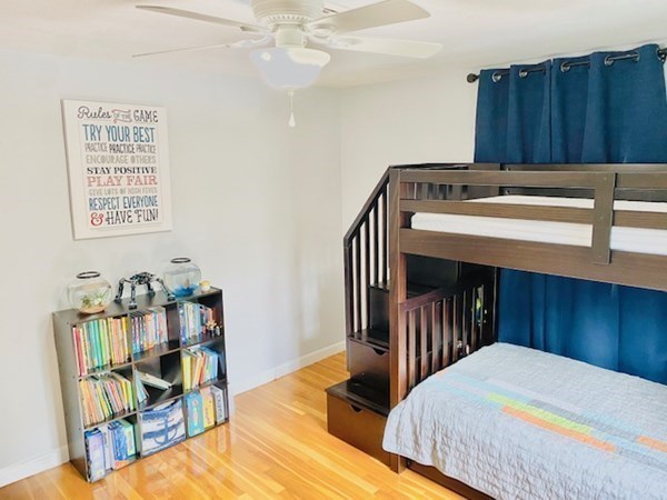 6 Saugus Avenue, Unit A Saugus, MA 01906 - Photo 17 of 26 a bedroom with a bed and a bookshelf