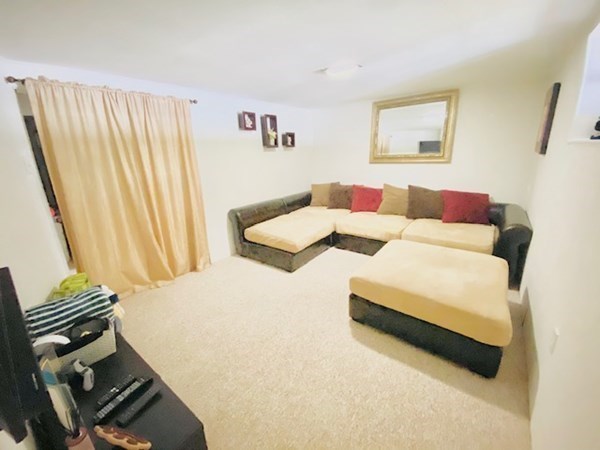 6 Saugus Avenue, Unit A Saugus, MA 01906 - Photo 24 of 26 a bedroom with a bed and a painting on the wall