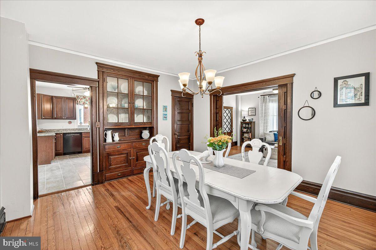 144 South Main Street Boonsboro, MD 21713 - Photo 11 of 48 a dining room with furniture a chandelier and wooden floor