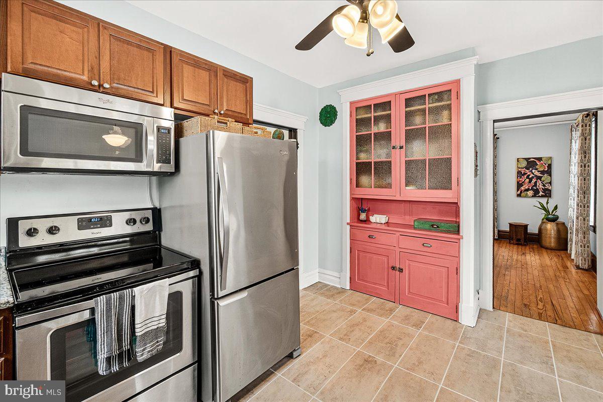 144 South Main Street Boonsboro, MD 21713 - Photo 15 of 48 a kitchen with stainless steel appliances granite countertop a refrigerator a stove and a microwave with cabinets