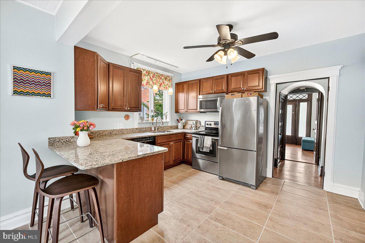 144 South Main Street Boonsboro, MD 21713 - Photo 20 of 48 a kitchen with refrigerator cabinets and wooden floor
