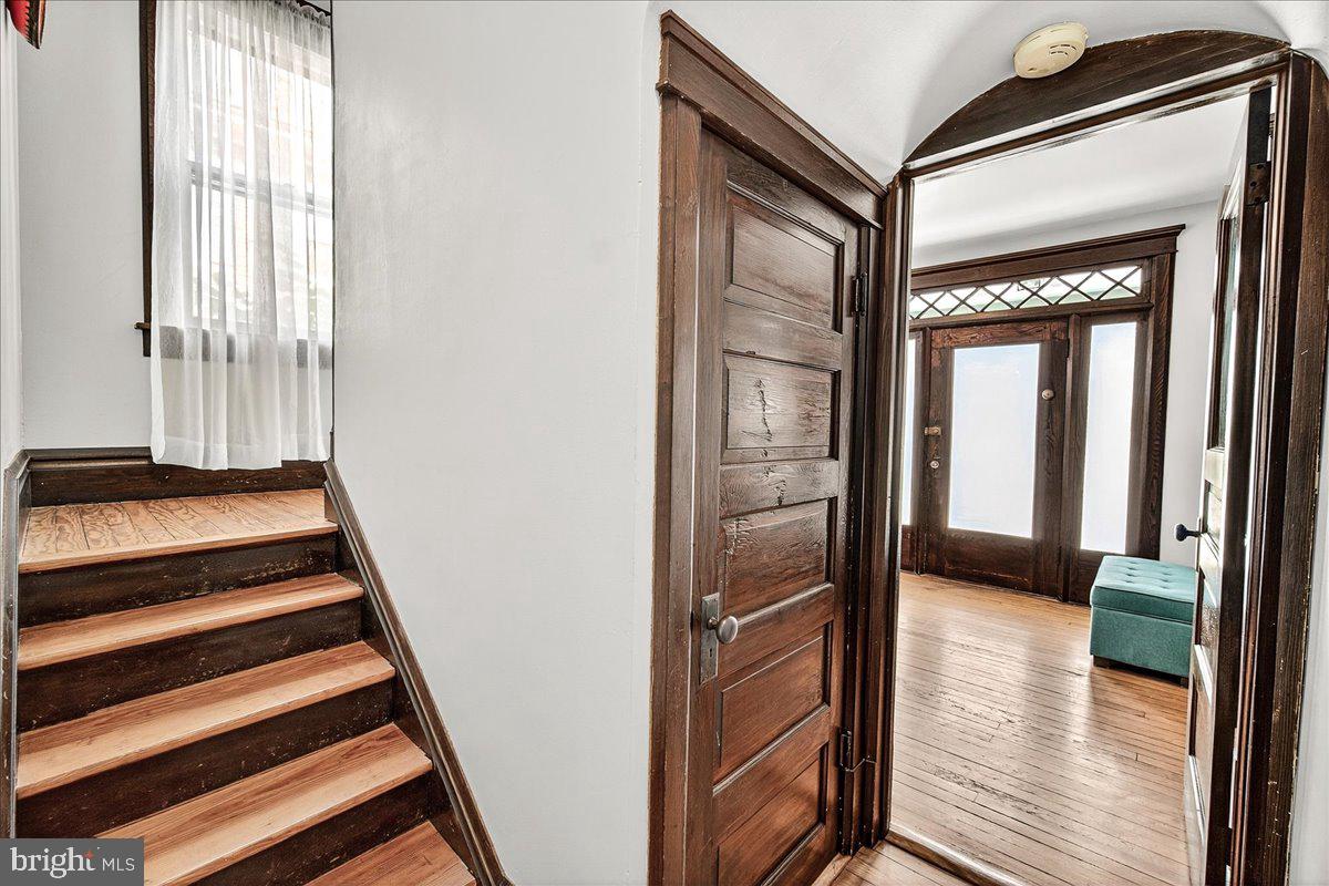 144 South Main Street Boonsboro, MD 21713 - Photo 21 of 48 a view of a hallway with wooden floor and staircase