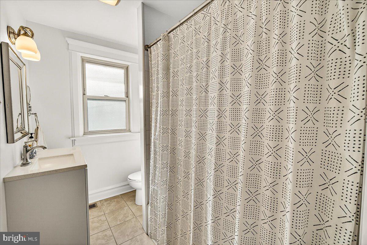 144 South Main Street Boonsboro, MD 21713 - Photo 24 of 48 a bathroom with a shower curtain and a sink