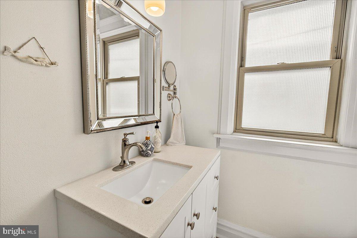 144 South Main Street Boonsboro, MD 21713 - Photo 25 of 48 a bathroom with a sink and a mirror