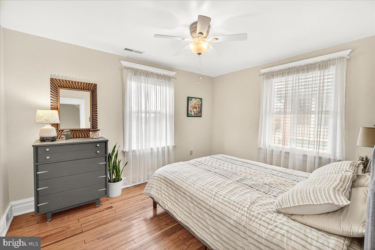 144 South Main Street Boonsboro, MD 21713 - Photo 27 of 48 a bedroom with a bed and a mirror on a dresser