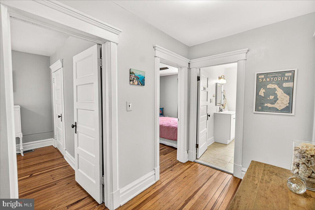 144 South Main Street Boonsboro, MD 21713 - Photo 29 of 48 a view of a hallway with wooden floor and cabinet