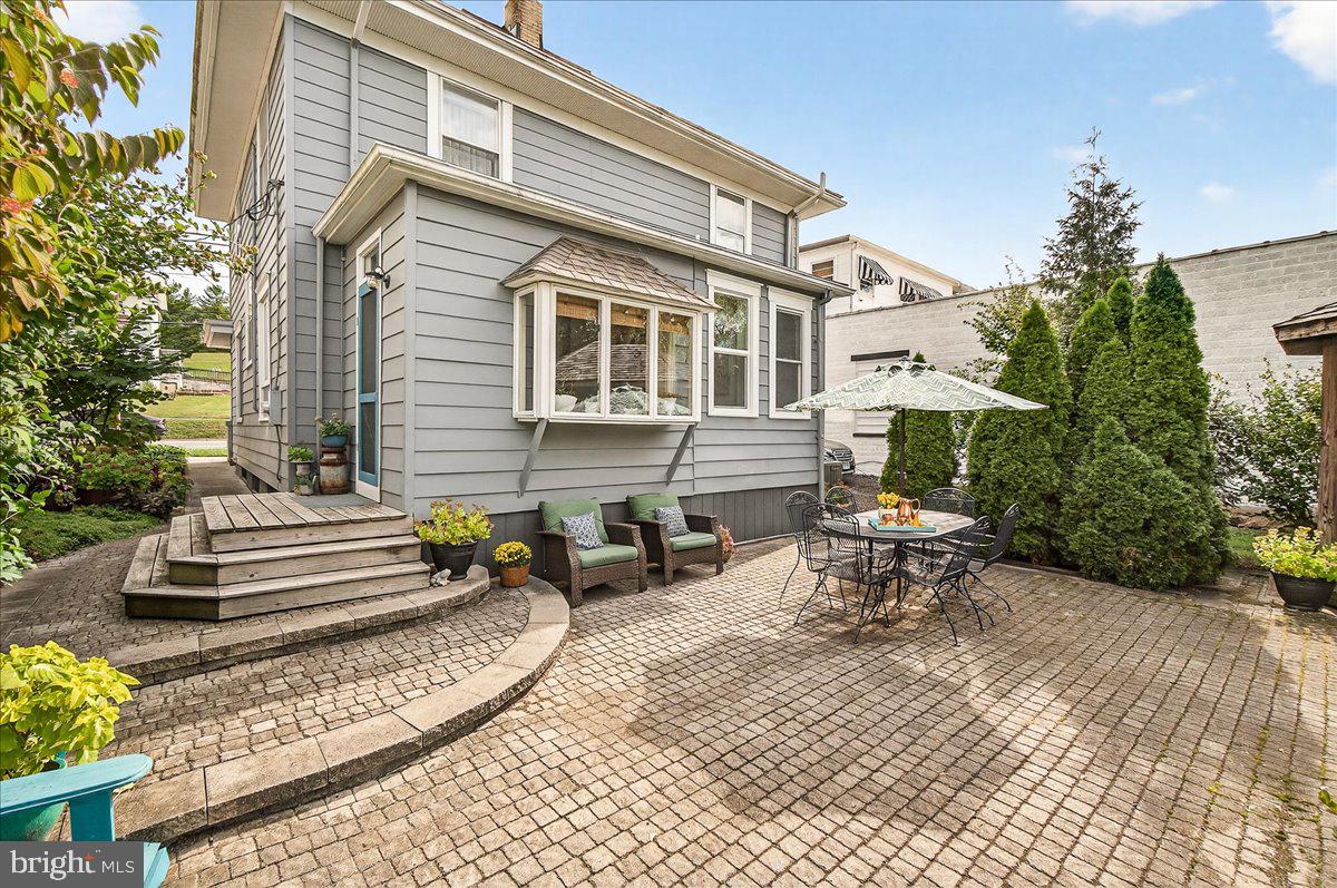 144 South Main Street Boonsboro, MD 21713 - Photo 40 of 48 a view of a patio with a table and chairs and potted plants