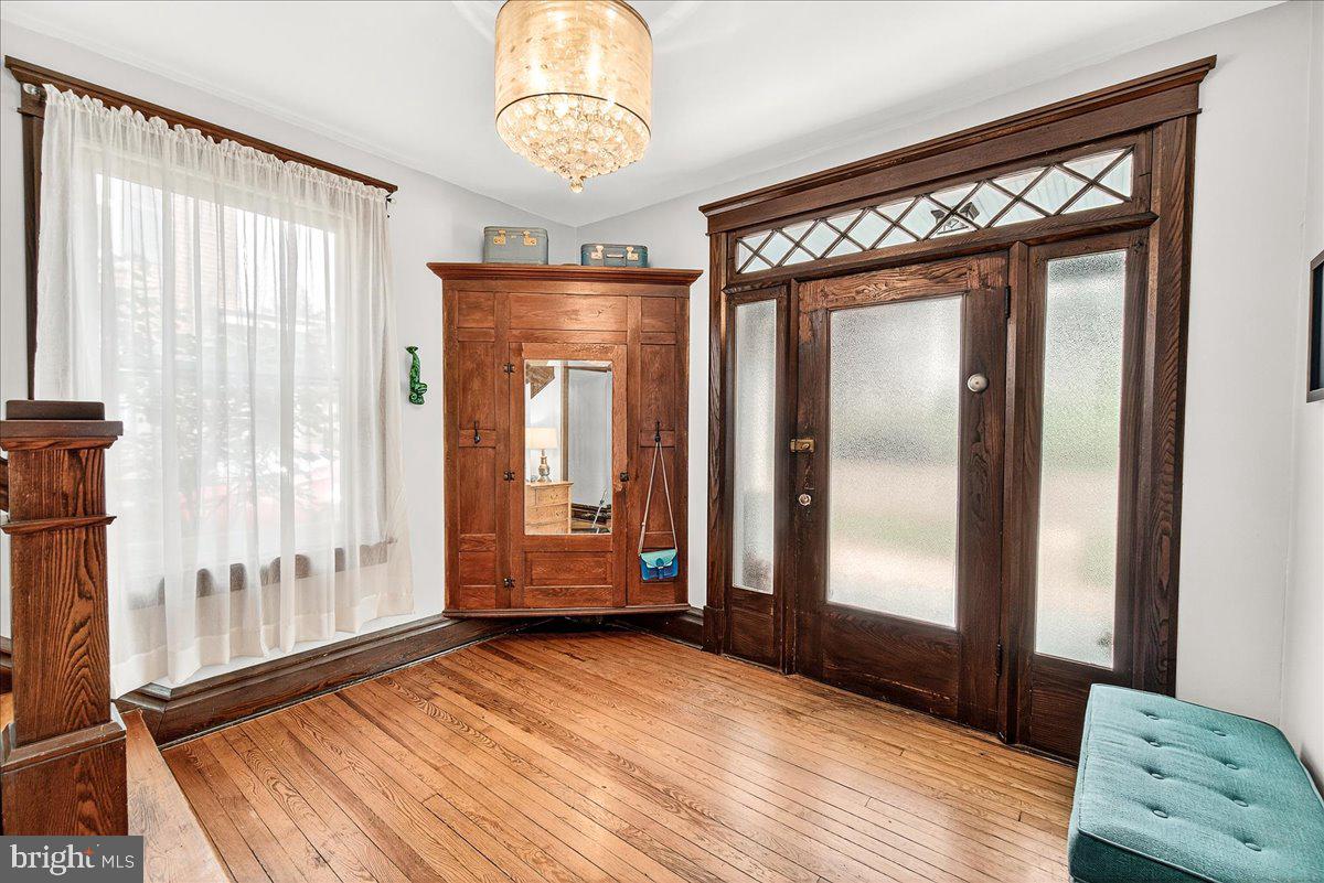 144 South Main Street Boonsboro, MD 21713 - Photo 6 of 48 a view of an empty room with wooden floor and a window
