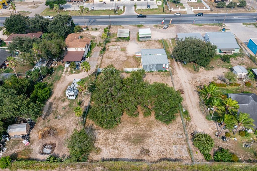 6106 North La Homa Road Mission, TX 78574 - Photo 4 of 10 an aerial view of a house with a yard and lake view