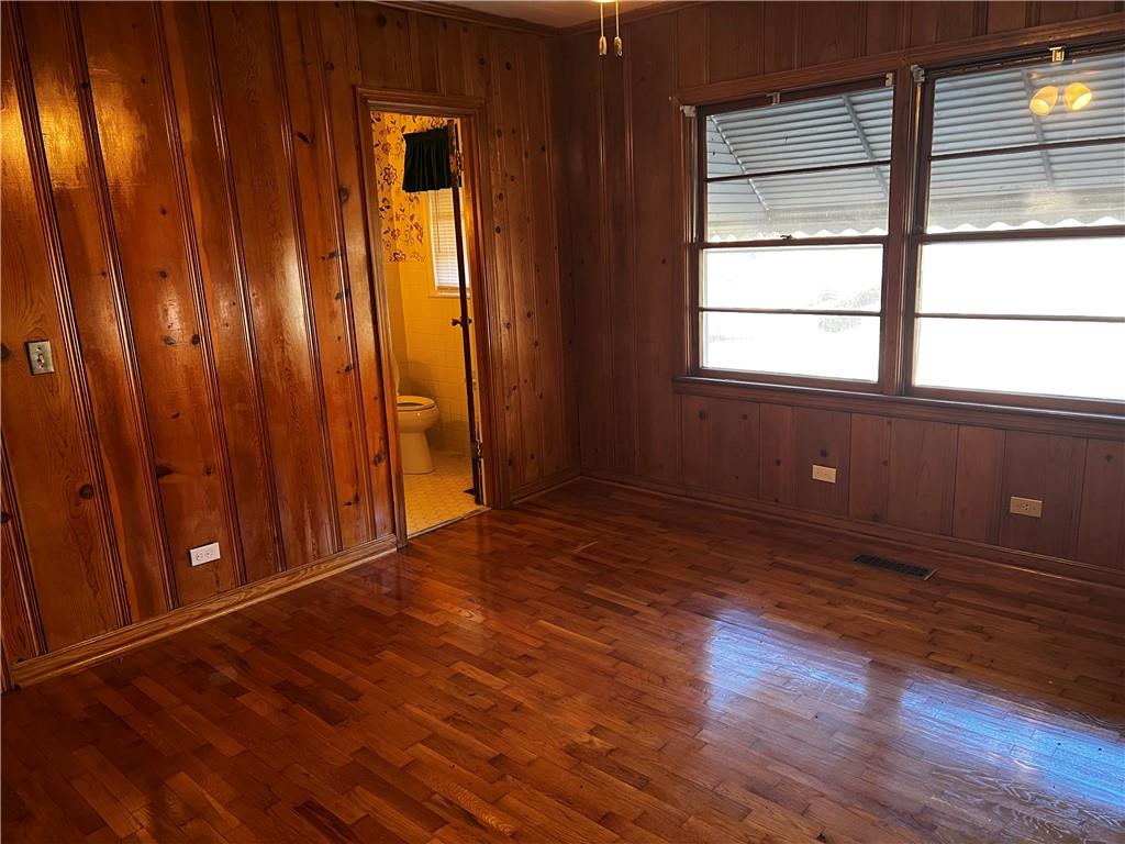 606 Pisgah Way Calhoun, GA 30701 - Photo 12 of 18 a view of an empty room with wooden floor and a window