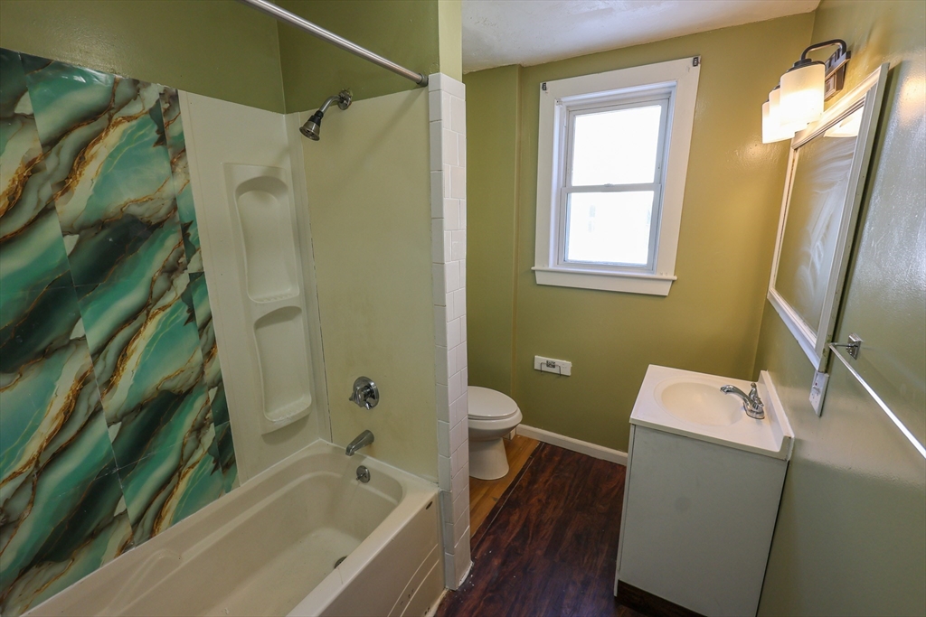 35 Clarkson Street, Unit 2 Boston, MA 02125 - Photo 5 of 9 a bathroom with a bathtub and a shower