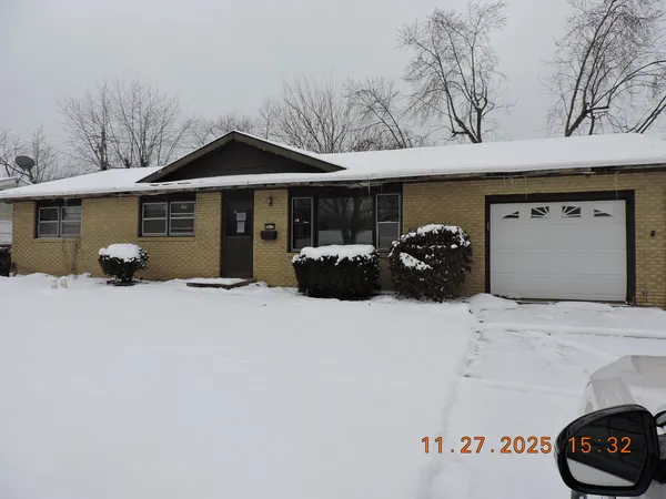 a front view of a house with parking