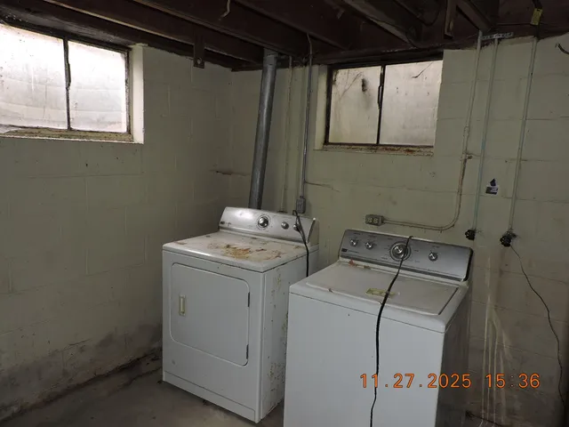 a utility room with dryer and washer